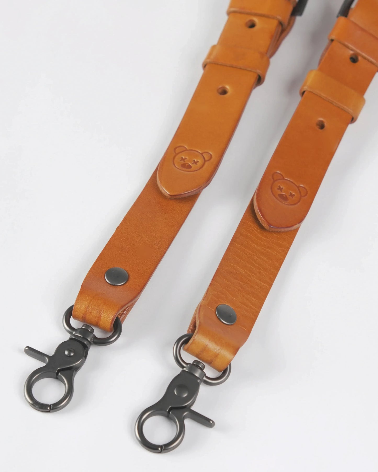 Close-up of the sleek brown leather strap embossed with the Marceau & Luthier logo.